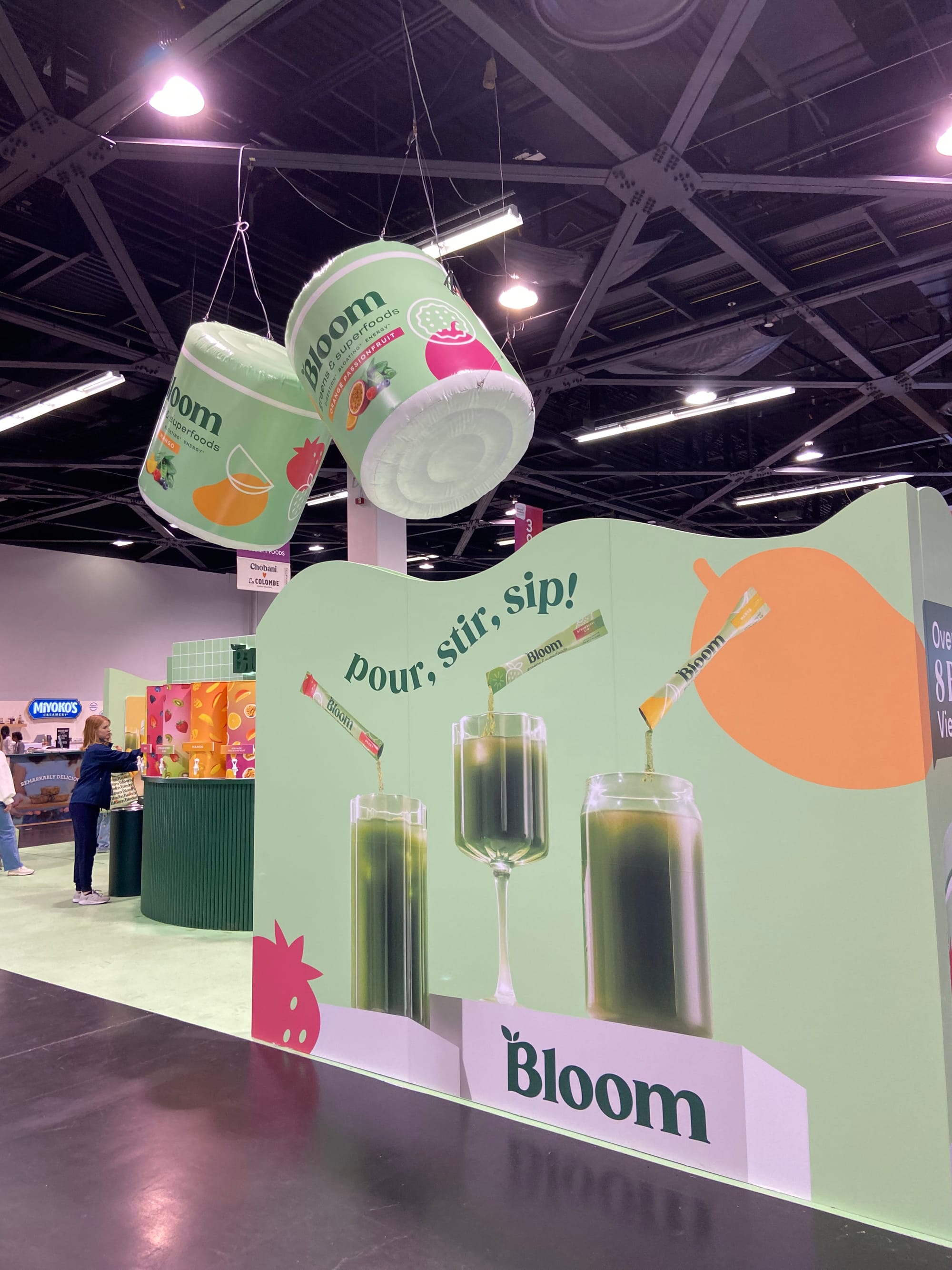 Trade show booth for the brand Bloom, with inflatable supplement containers